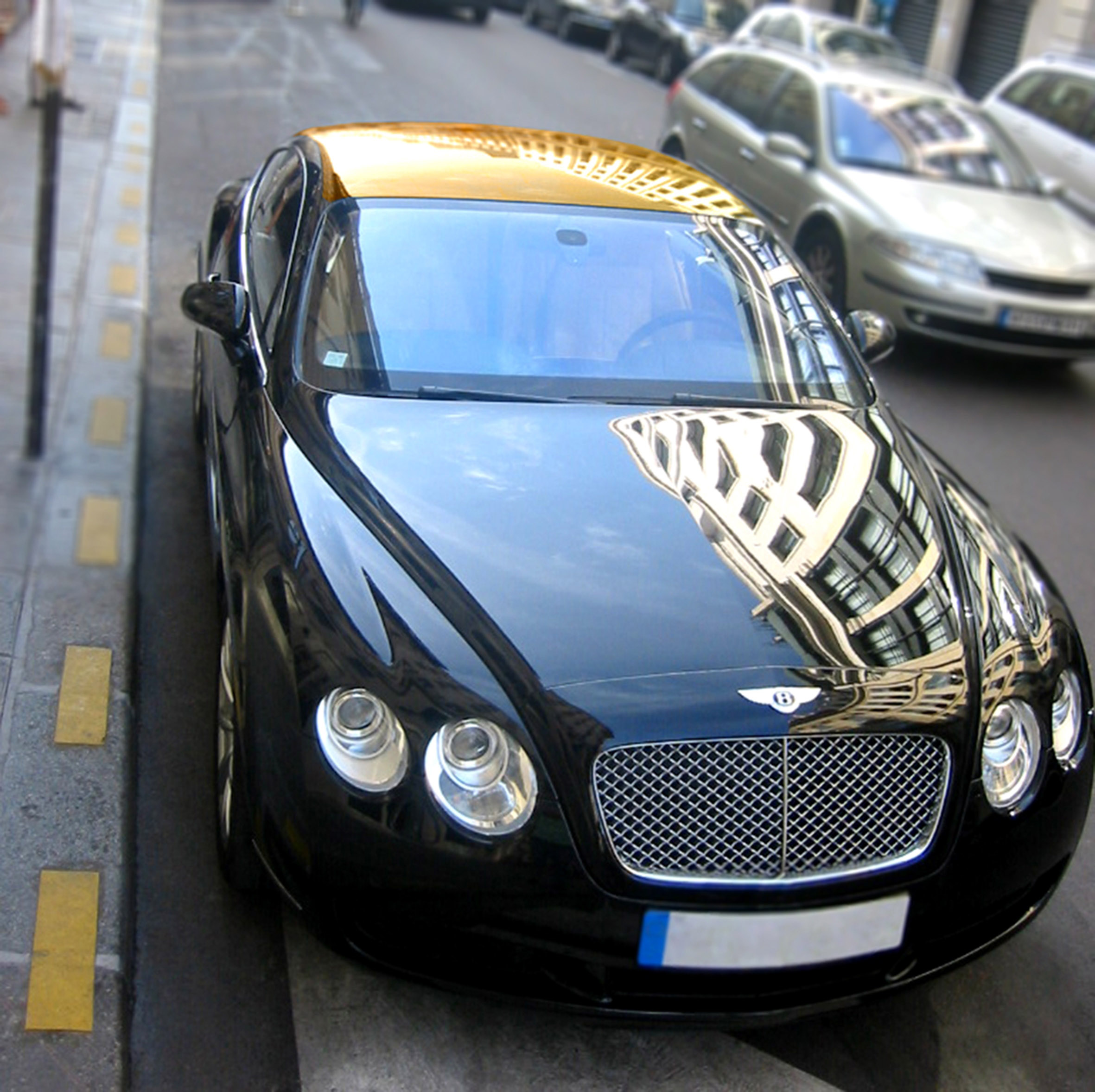 Bentley and Aston Martin with the Golden Roof