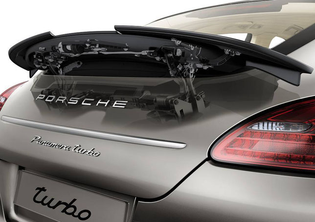 Adaptive-motion rear spoiler with side sections moving up separately Adaptive-motion rear spoiler with side sections moving up separately